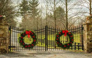 Driveway gate with holiday wreaths