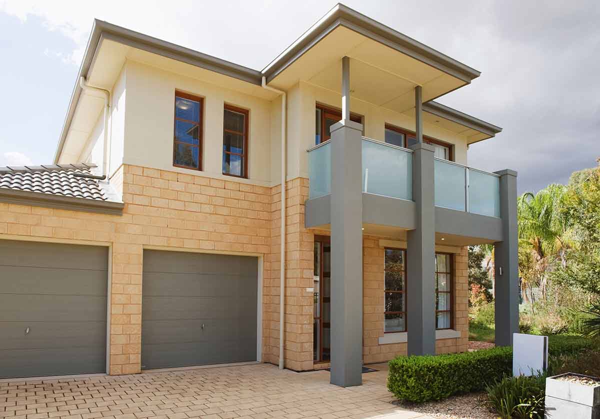 Modern house with painted sectional garage doors