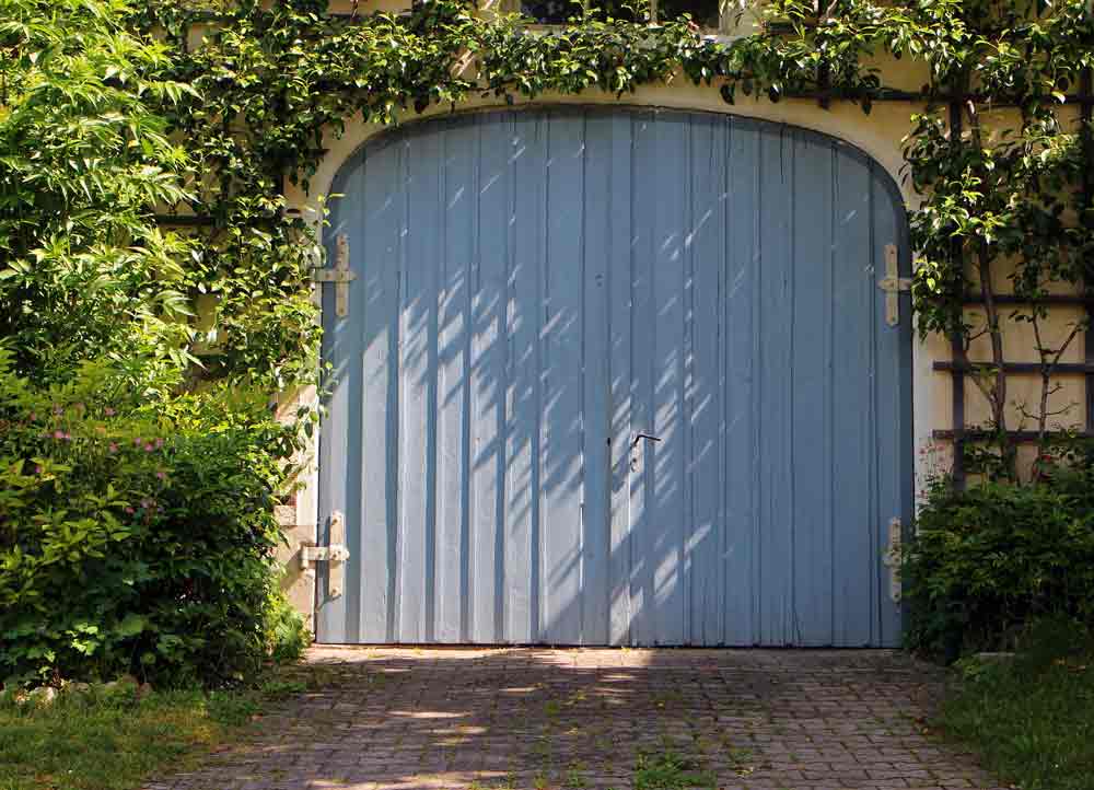 Side-hinged residential garage door